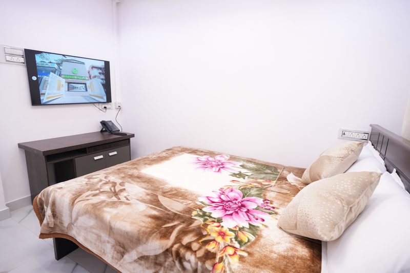 Guest room bed, floral cover